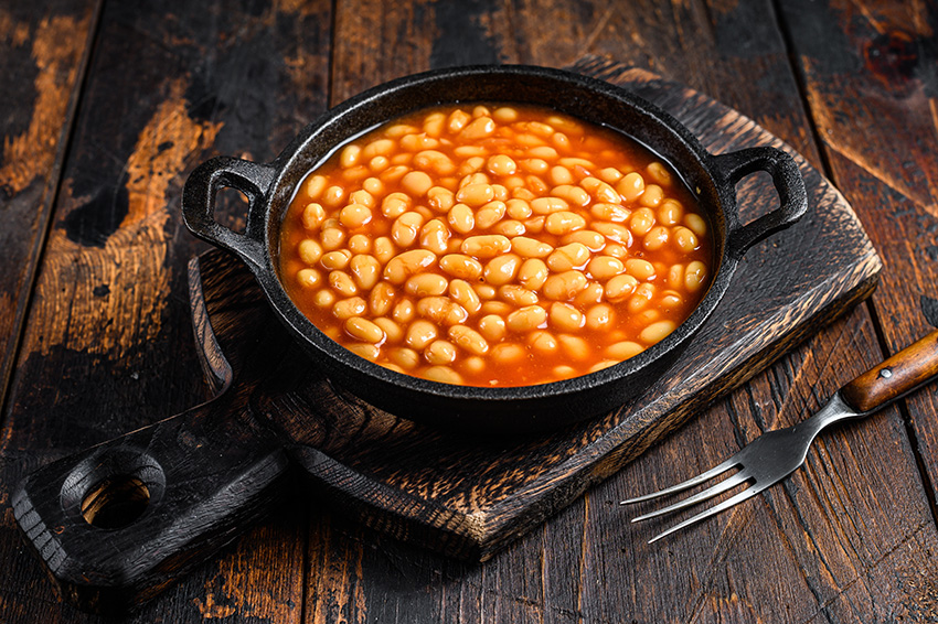 beans in tomato sauce in a pan dark wooden backgr 2021 10 21 02 55 35 utc