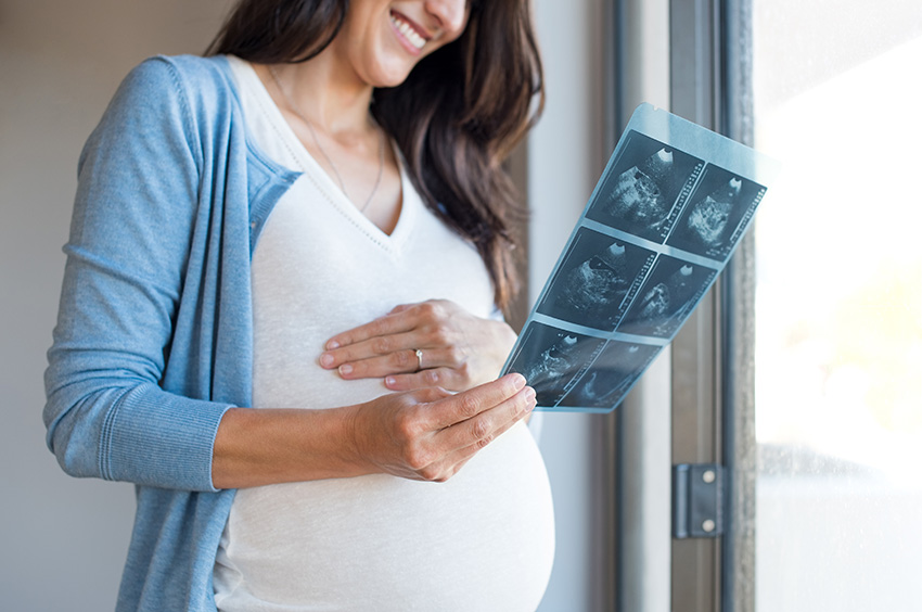 pregnant woman holding ultrasound 2021 08 26 15 34 40 utc